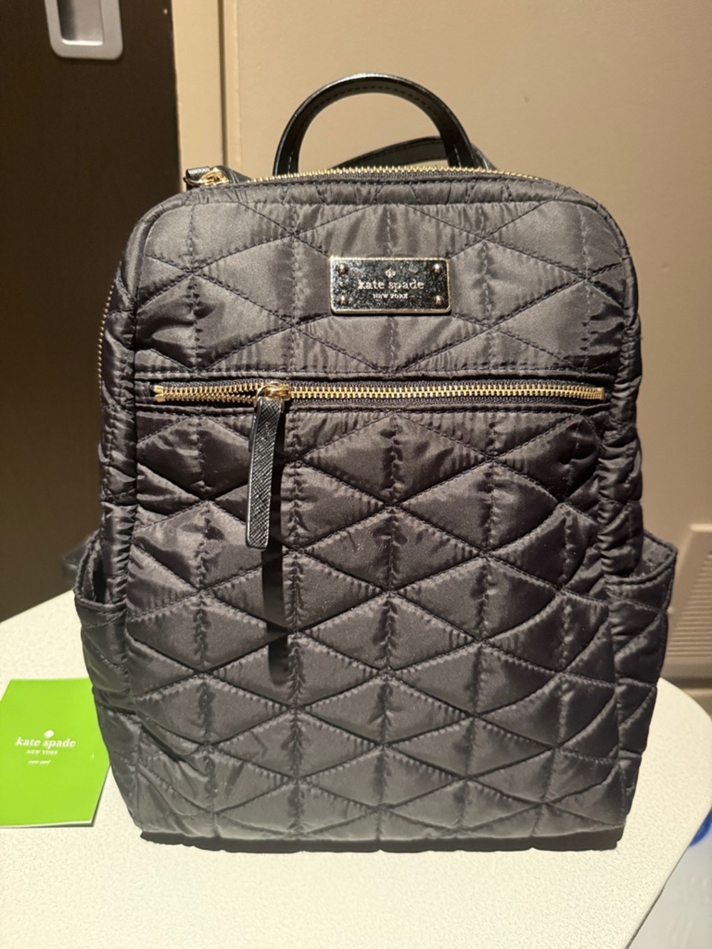 kate spade Black Quilted Nylon Backpack with Gold Hardware